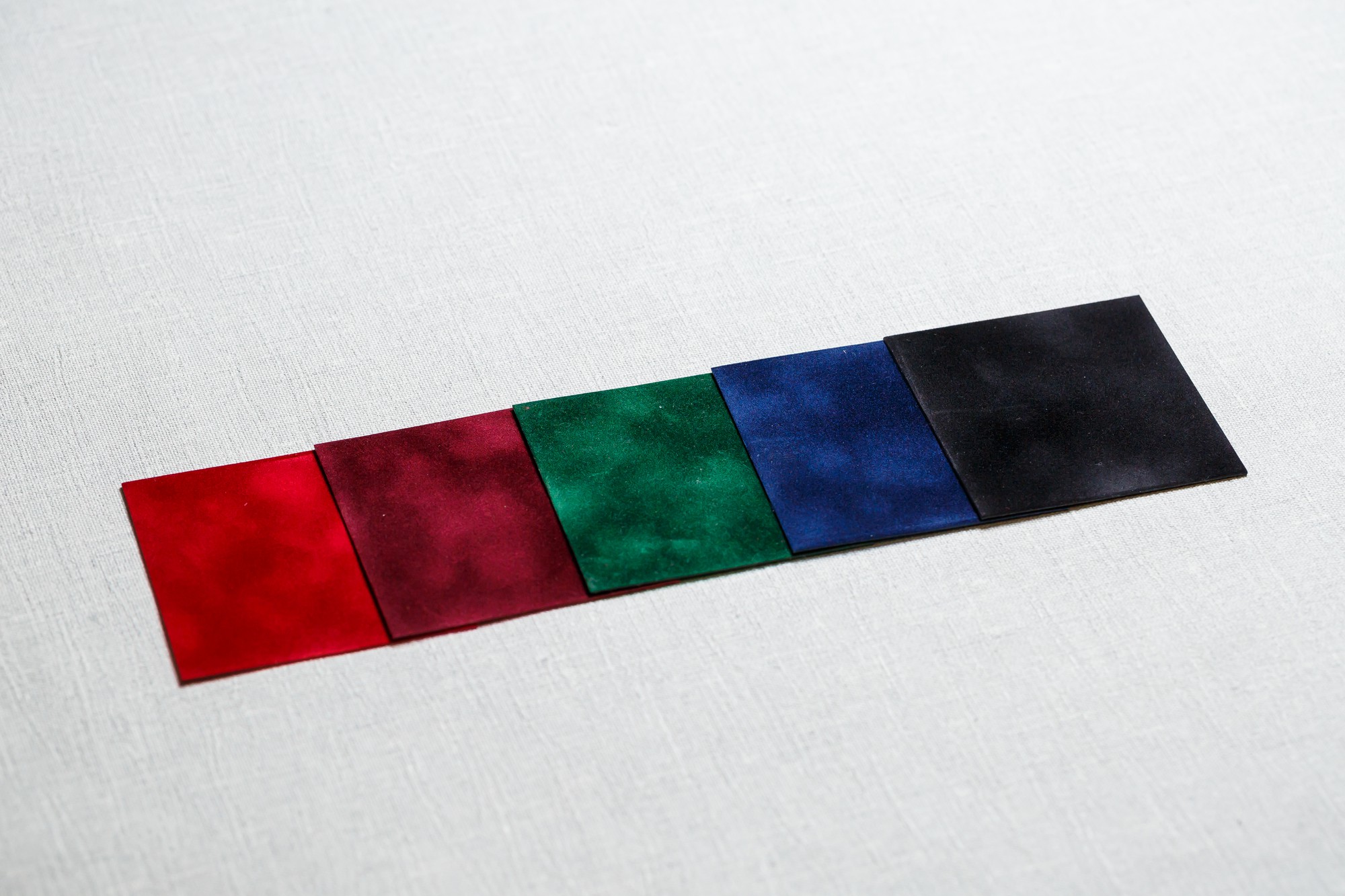 Samples of embroidered badges and fabric swatches